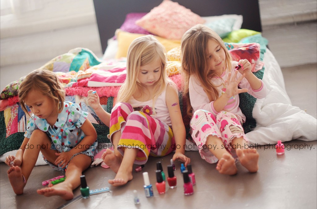 Portrait of three girls painting their nails by Sarah-Beth Photography