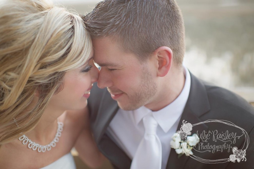 Bride and groom posing outside for Julie Paisley Photography