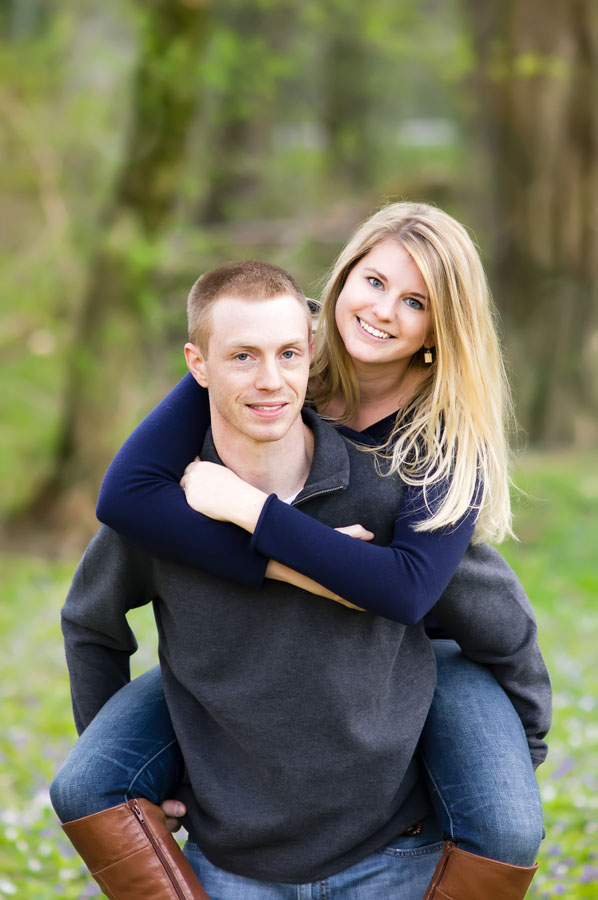 Portrait of couple with girl on guy's back by Kelly Broyles Photography