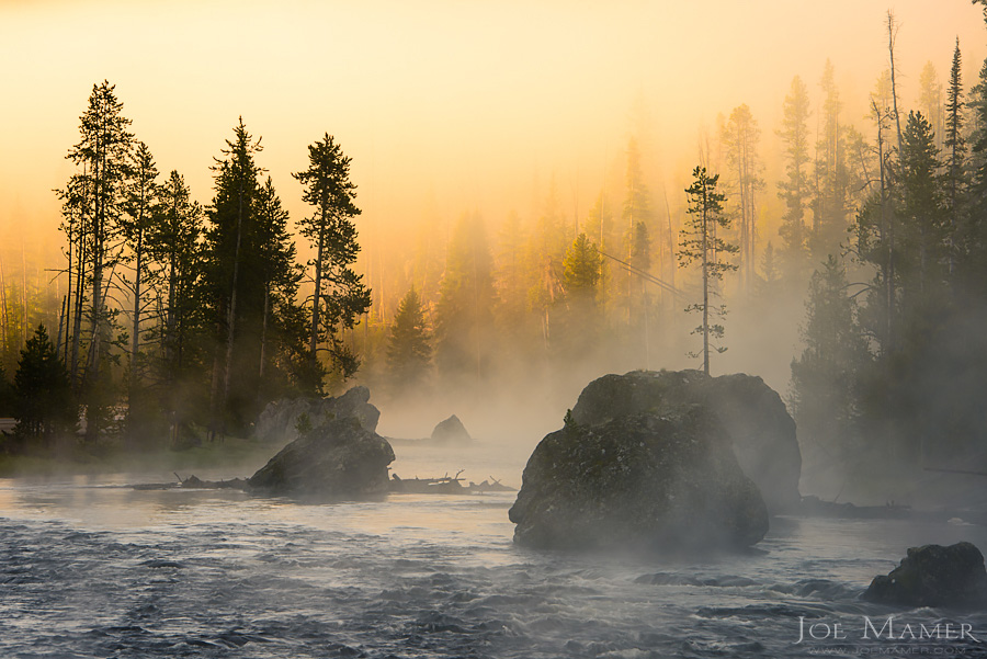 Foggy sunrise on the Firehole River in Yellowstone National Park.
