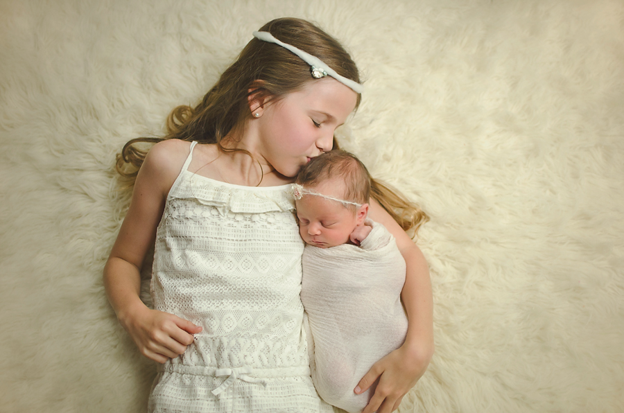 Big sis here was definitely capable of holding her little sister and taking direction from me. That’s not always the case when you’ve got a much smaller age gap between siblings. Nikon D700, 35mm, f2, 1/500